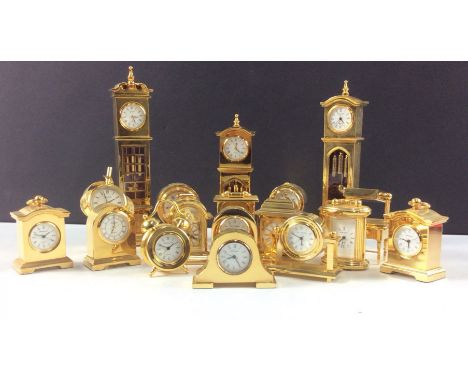 Large collection of 18 miniature brass clocks of various designs, to inlude 2 grandfather and a grandmother, dressing table w