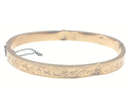 A 375 stamped yellow gold child's snap-shut bracelet weight 4.2g - inner dimension when closed 5.5cm diameter - a few dents o