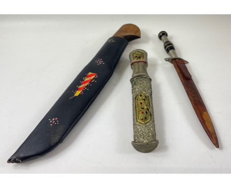 A collection of three knives, one handmade with interesting brass inlay length 32cm approx with sheath, a Far Eastern intrica