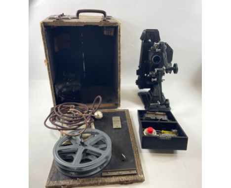 A vintage 1939 PATHESCOPE "200-B" PLUS PROJECTOR for both 9.5 and 16mm films comes in its original box complete with instruct