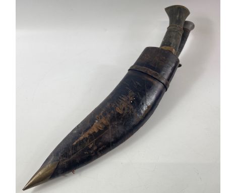 A VINTAGE KUKRI KNIFE (with No 991 stamped on the base of the blade) with two smaller accompanying knives, all within its ori