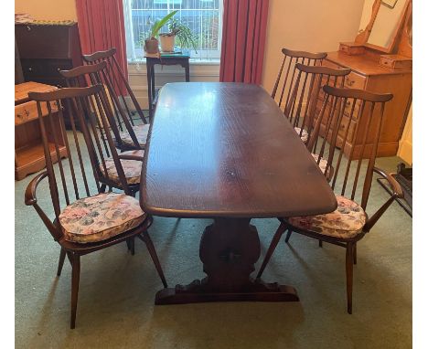 A VINTAGE LARGE ERCOL dining table with four chairs and two carvers - dimensions 6ft x 3ft wideApprox 7 pieces