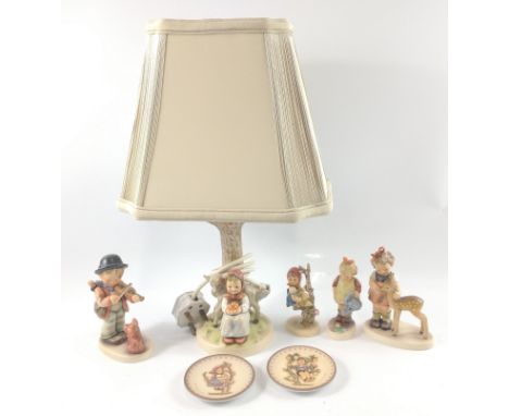 A collection of GOEBBEL HUMMEL figurines to include a 'Good Friends' table lamp (model 228) with shade standing 40cm high als