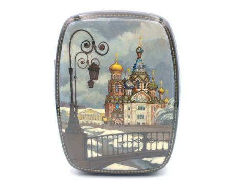 A Russian laquered snuff box with a design of St Basil's cathedral 10cm longApprox 1 pieces