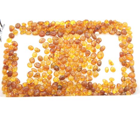 Quantity of small amber polished beads. P&amp;P Group 1 (£14+VAT for the first lot and £1+VAT for subsequent lots) 