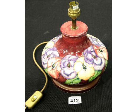 Moorcroft bulbous Pansy lamp with dark pink ground. P&amp;P Group 1 (£14+VAT for the first lot and £1+VAT for subsequent lots