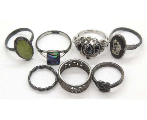 Seven white metal and silver rings. P&amp;P Group 1 (£14+VAT for the first lot and £1+VAT for subsequent lots) 