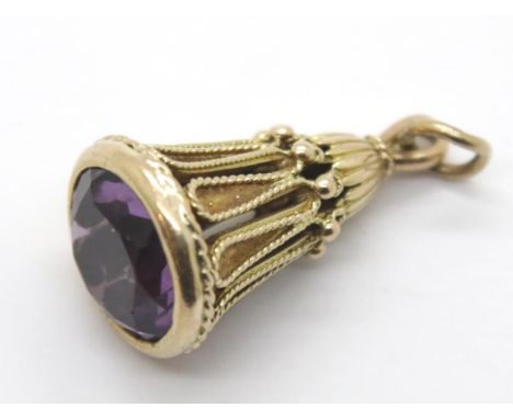9ct gold tapered fob set with a large brilliant cut amethyst, 9.2g. P&amp;P Group 1 (£14+VAT for the first lot and £1+VAT for