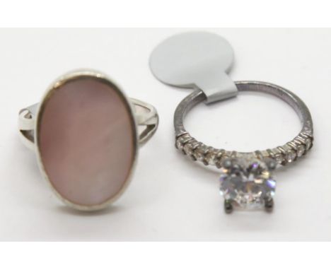 Silver dress ring set with mother of pearl and a fancy silver cubic zirconia ring. P&amp;P Group 1 (£14+VAT for the first lot