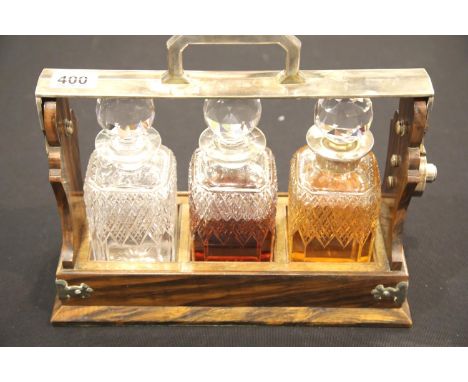 Betjemann, London rosewood based three-bottle tantalus with silver plated fittings, lock and handle, impressed makers mark. H