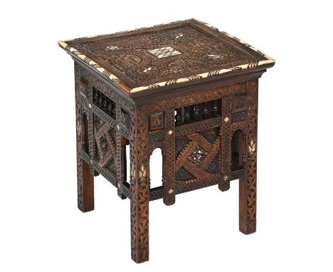 Islamic furniture. A Syrian carved wood and mother-of-pearl and bone inlaid table, late 19th c, the top with calligraphy, 45c