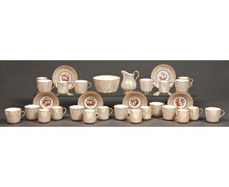 An English porcelain part tea and coffee service, 19th c, painted with a central floral spray of flowers and gilded vermicell