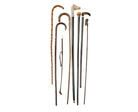 Miscellaneous silver mounted walking canes and a riding crop, Victorian and later (8) 