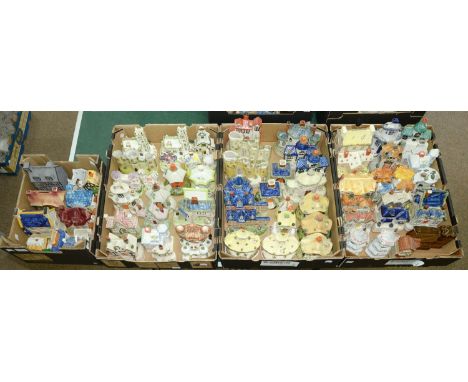 Miscellaneous earthenware and porcelain cottages, pastille burners and money banks, 20th c, various makers including Coalport