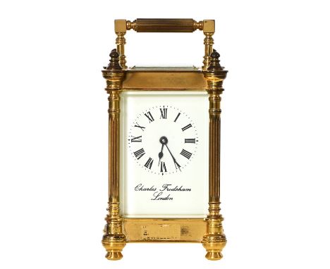 A brass carriage timeplace, Charles Frodsham, London with  platform lever escapement, bevelled glass lights flanked by pillar