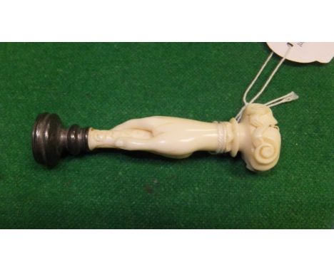 A Victorian carved ivory handled seal as a hand holding a seal with carved hardstone facia, 8.2 cm high CONDITION REPORTS Som