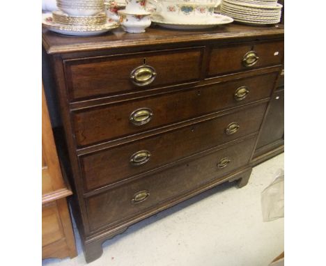 A 19th Century oak and crossbanded chest of two short over three long drawers, on bracket feet
