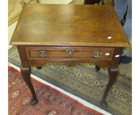 A 19th Century oak single drawer side table on cabriole legs to pad feet and a baluster shaped serpentine style table lamp