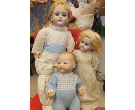 An Armand Marseille bisque headed doll, inscribed to verso of head "AM Germany 351/3½K", with sleep eyes, open mouth and comp