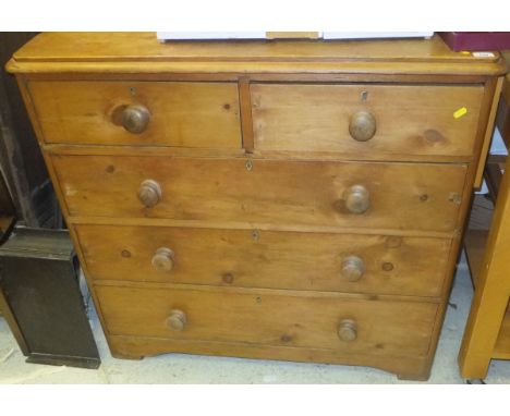 A pine chest of two short and three long drawers on bracket feet