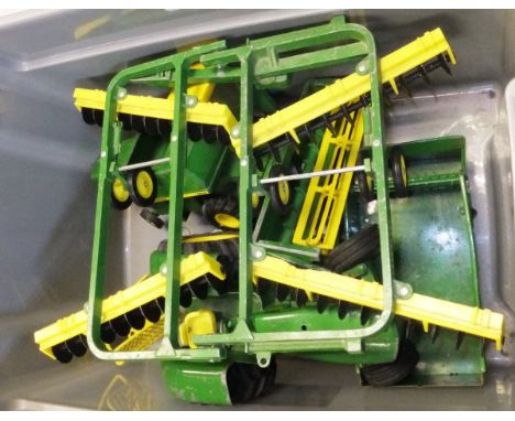 A collection of Ertl John Deere farm models including 6600 Combine Harvester, 5020 Diesel Tractor, Bailer, Muck Spreader Trai