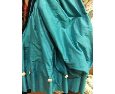 A pair of turquoise silk interlined curtains with goblet heading and cream silk button decoration