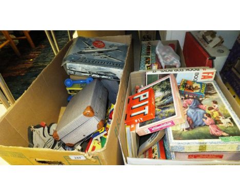 Three boxes of various toys and games including Marx Deluxe Typewriter, Bristol Britannia friction drive aeroplane, The Sooty