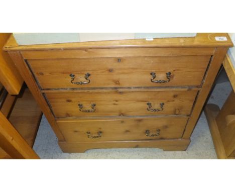 A pitch pine chest of three long drawers on bracket feet