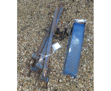 A set of four sash cramps, two car ramps and two axle stands
