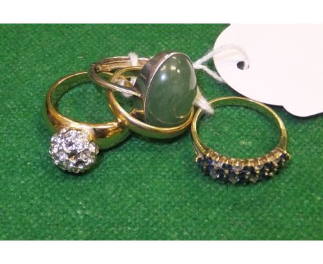 An 18 carat gold wedding band, a 15 carat gold and sapphire and diamond set dress ring, a white metal and jade mounted dress 