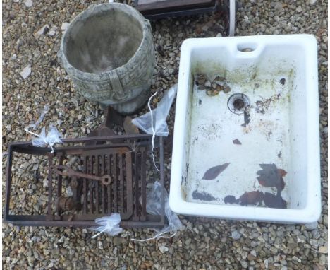 A cast iron fire basket, a Belfast sink, and a composite stone planter