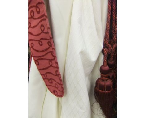 Nine pairs of co-ordinating cream cotton curtains with various tie-backs to include a pair of red tassel tie-backs