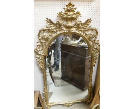 A pair of large brass columnar table lamp bases, together with a 20th Century cream desk lamp and modern gilt framed wall mir