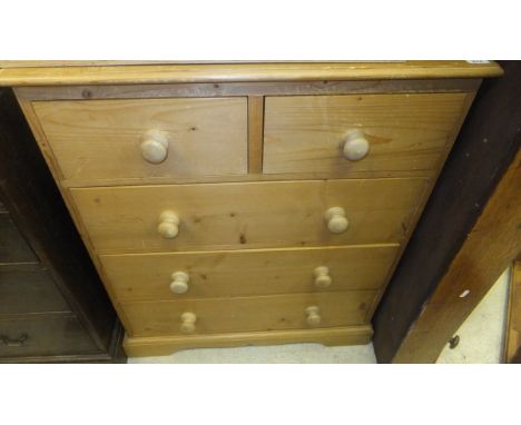 A modern pine chest of two short and three long drawers on bracket feet, together with a pine framed rectangular wall mirror