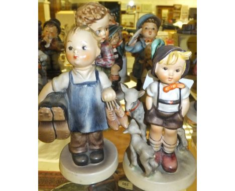 A collection of eight Goebel Hummel figures to include "Boots", "Little goat herder", "Busy student", "Little tailor", "Flowe