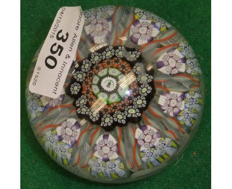 A Perthshire Paperweights glass paperweight with central thistle decoration and medallion, inscribed verso "97 IPS", 8 cm dia
