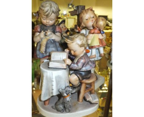 A collection of five Goebel Hummel figures to include "The mail is here", "Little book keeper", "Kiss me", "Girl knitting" an