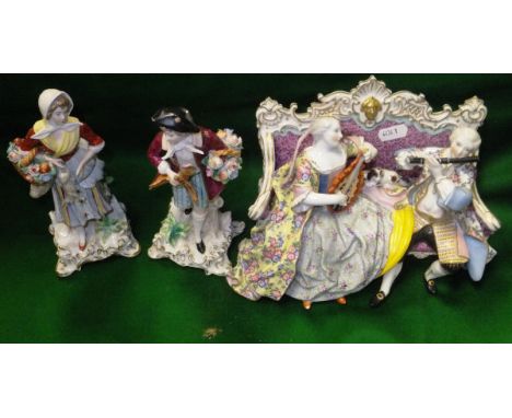 A Meissen porcelain sofa group depicting a lady and gentleman playing a lute and a flute, together with two Continental porce