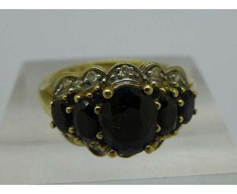 A 9ct gold, sapphire and diamond cluster ring, weight 4.3g, size R