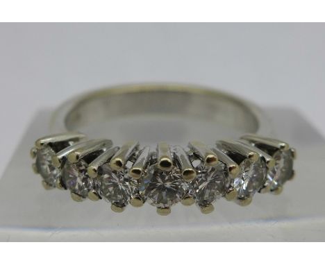 An 18ct white gold, seven stone diamond ring, over 1 carat total diamond weight, weight 5.3g, size N