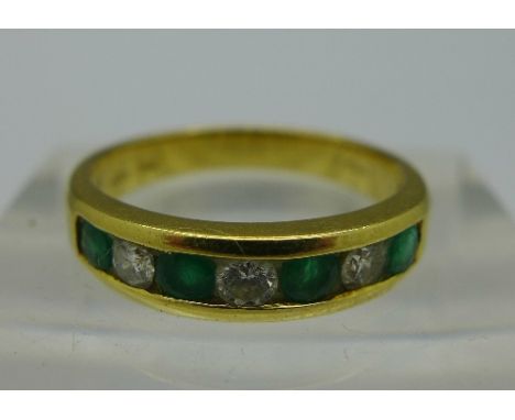 An 18ct gold, emerald and diamond ring, weight 3.5g, size N