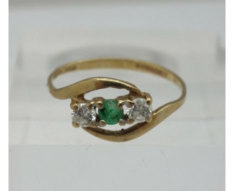 A 9ct gold, emerald and white stone ring, weight 0.9g, size K