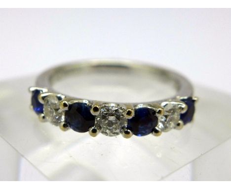 An 18ct white gold, sapphire and diamond ring, 0.4 carat sapphire weight, 0.36 carat diamond weight, total weight 3.7g, size 