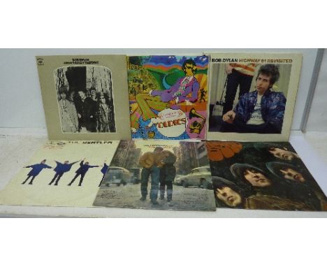 A collection of LP records including The Beatles Revolver, Help!, Rubber Soul and Abbey Road; Bob Dylan Highway 61 Revisited,