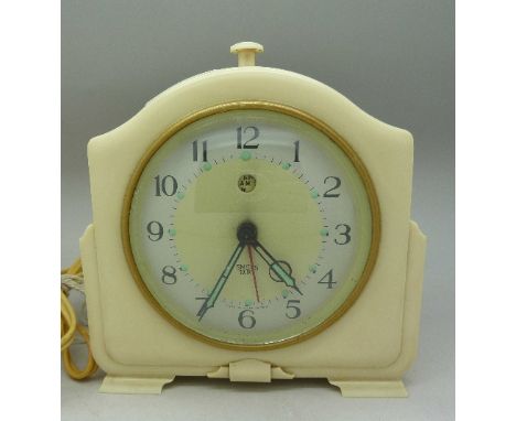 A cream Bakelite Smiths Sectric clock with alarm