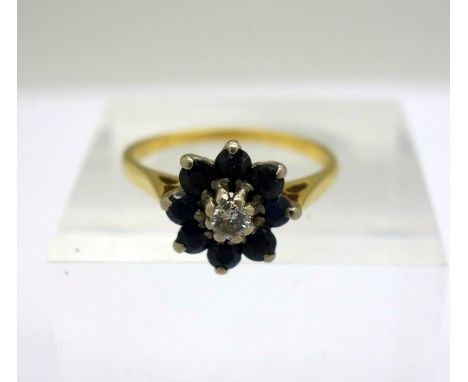 An 18ct gold, sapphire and diamond ring, weight 3g, size M