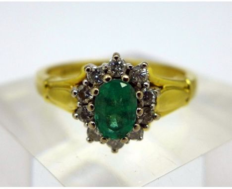 An 18ct gold, diamond and emerald cluster ring, weight 4.6g, size O