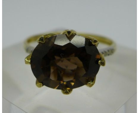 A 9ct gold, smoky quartz and diamond ring, weight 1.7g, size O