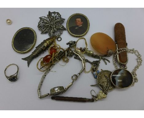 A lady's silver and marcasite wristwatch, a reticulated fish pendant, a horse shoe pin, a silver ring, brooch, etc.