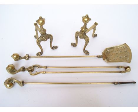 A pair of brass andirons with ball and claw terminals and matching fire tools (5).